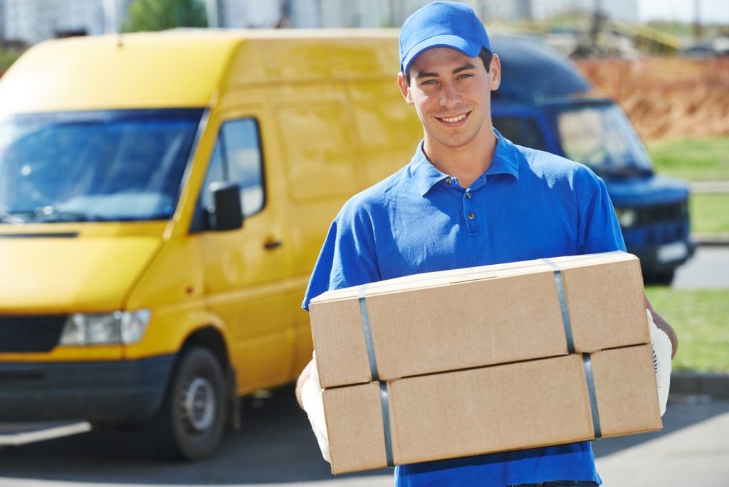 Express delivery service Dubai courier handing over parcel